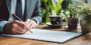 Israeli inheritance lawyer reviewing and signing a will document